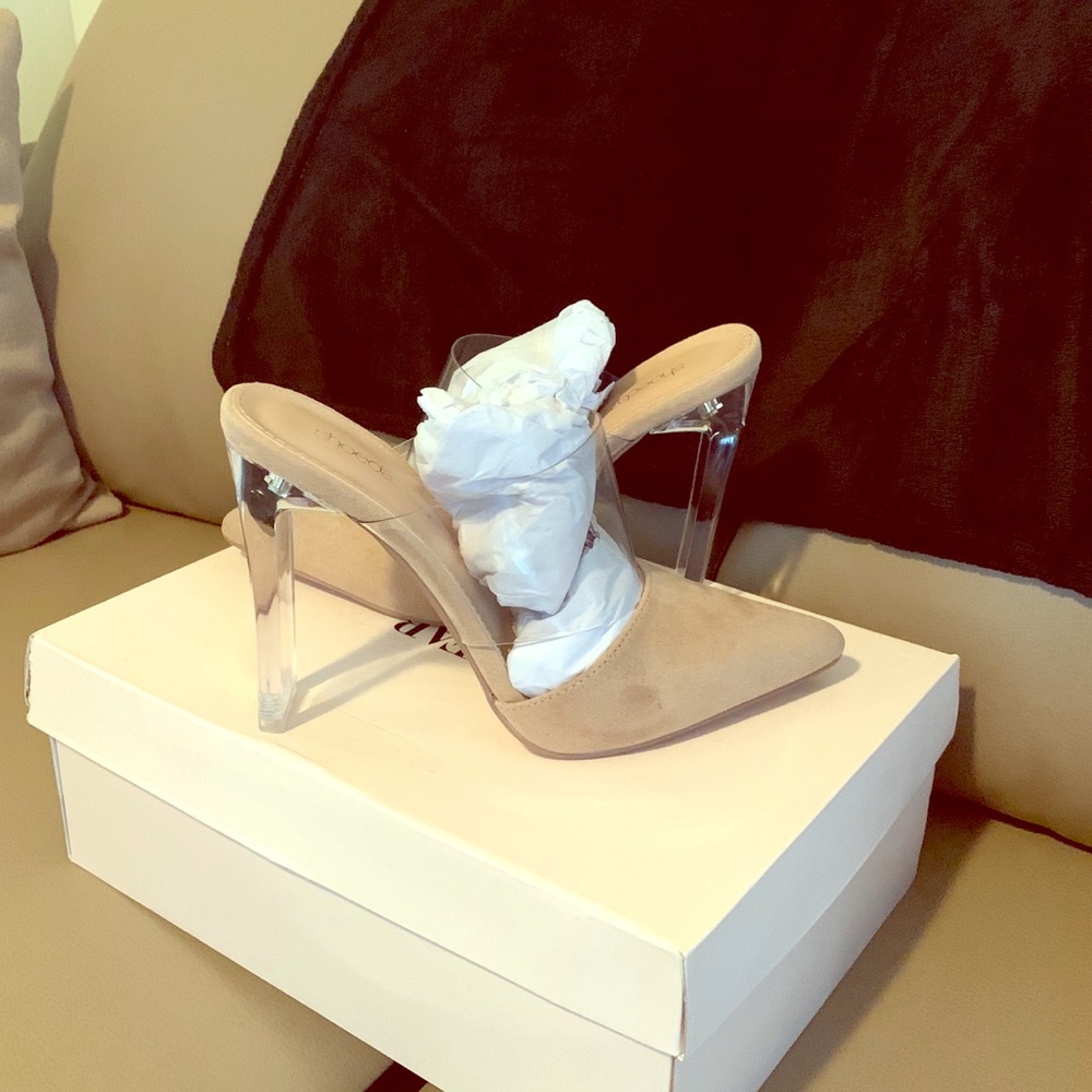 Beige shoes with a clear heal